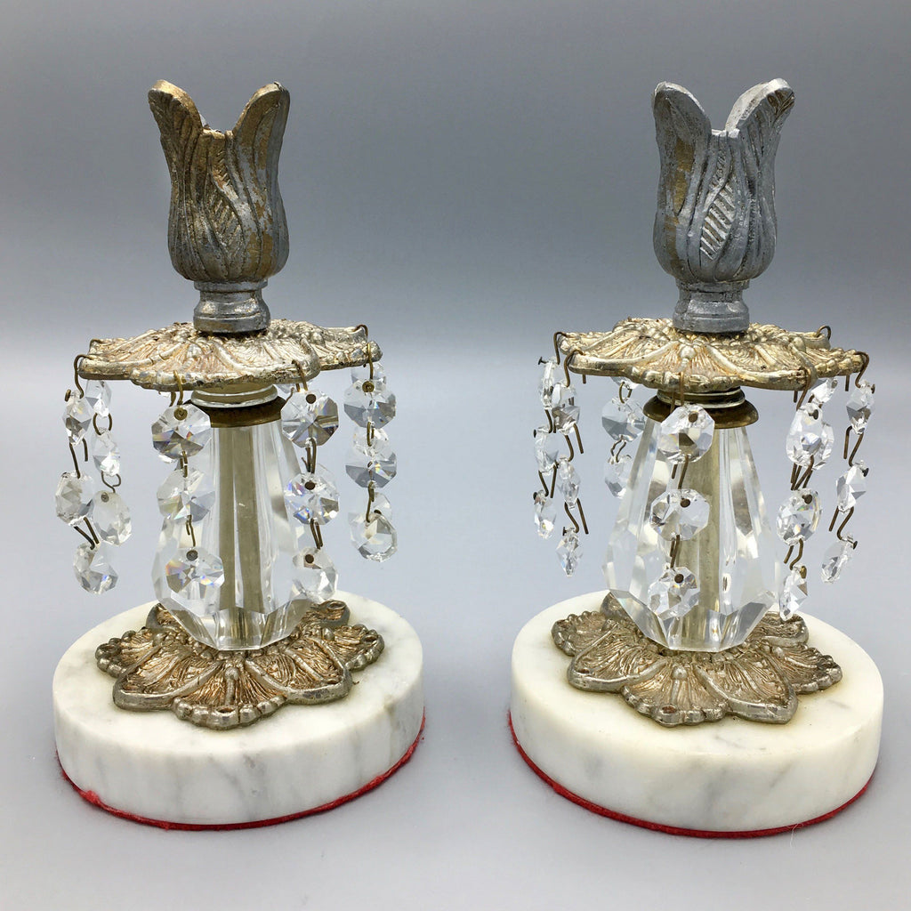 http://www.avantantique.com/cdn/shop/products/pair-of-vintage-candleholders-cast-metal-and-crystal-on-marble-base-candlestick-vintage-362749_1024x.jpg?v=1628127564